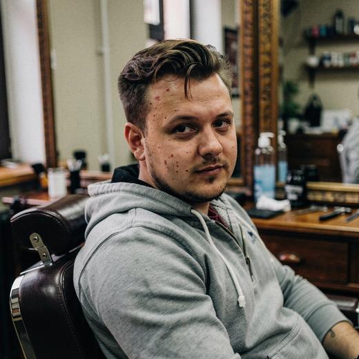 Before example haircut in a barbershop chair